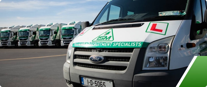 ISM learner van with ISM trucks in the background