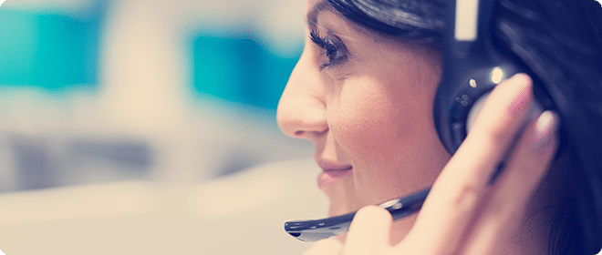 Woman in an offfice wearing a headset