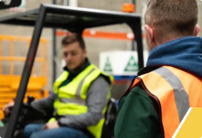 Man speaking to trainer in Forklift Training with ISM
