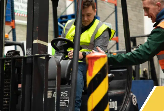 Trainer showing student controls in Forklift Training with ISM