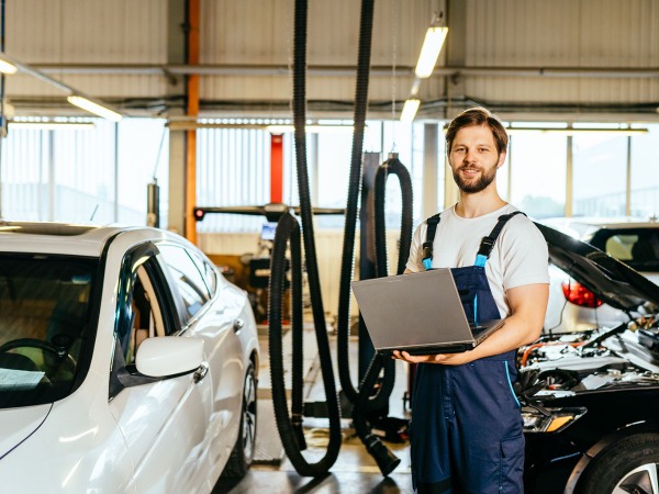 Mechanic using laptop